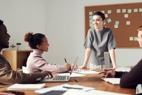 Image of four people at a work meeting